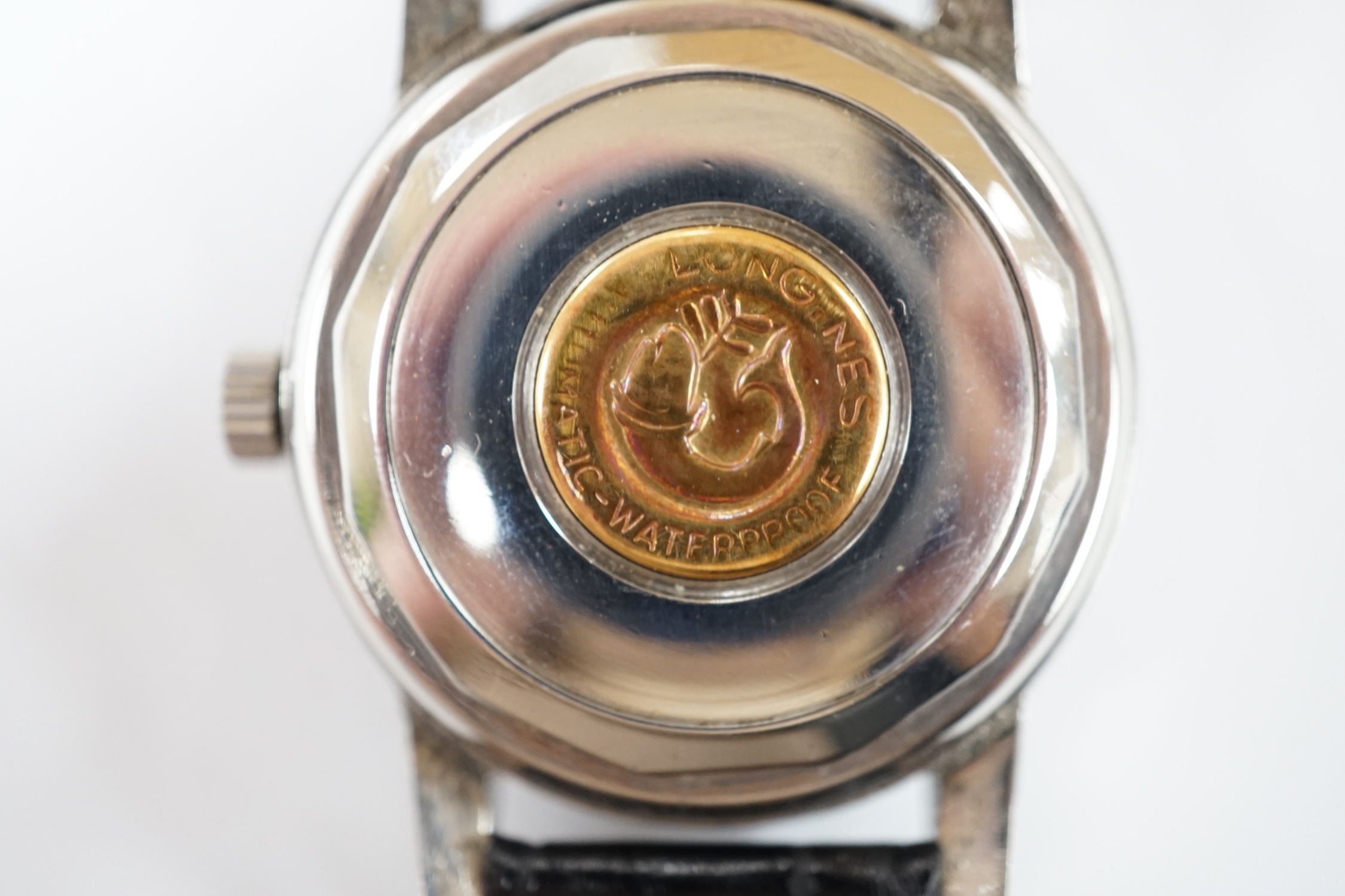 A gentleman's stainless steel Longines Conquest Calendar manual wind wrist watch, on Longines leather strap with Longines buckle, case diameter 35mm.